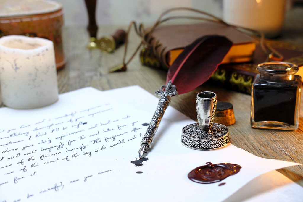 quill and paper indicating writing a life story ahead of death