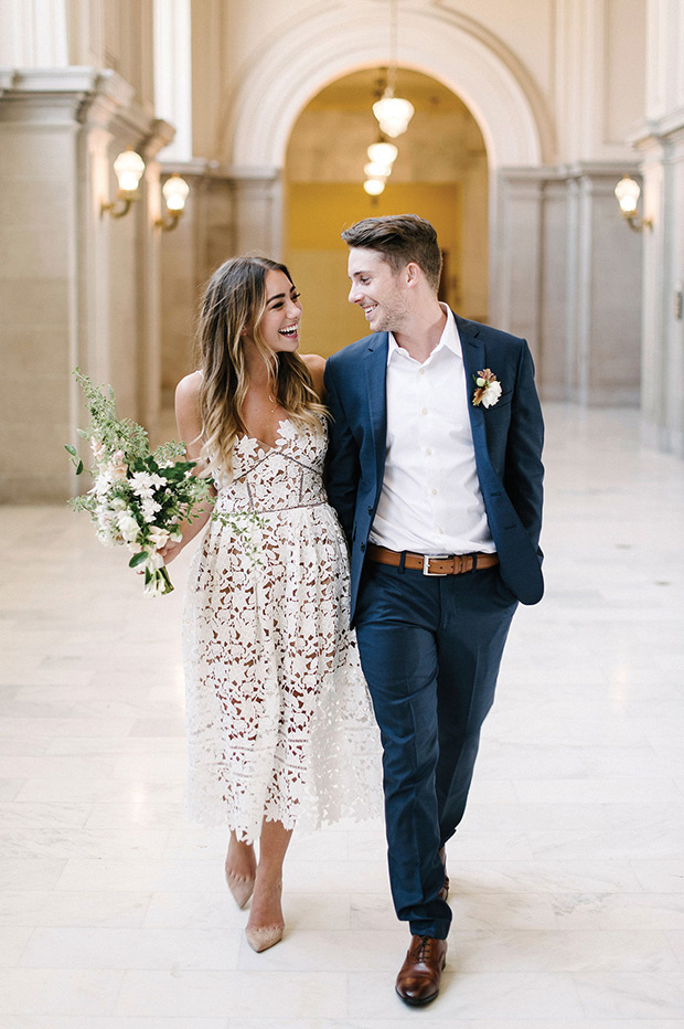 Young couple walking and smiling at each other after commitment ceremony
