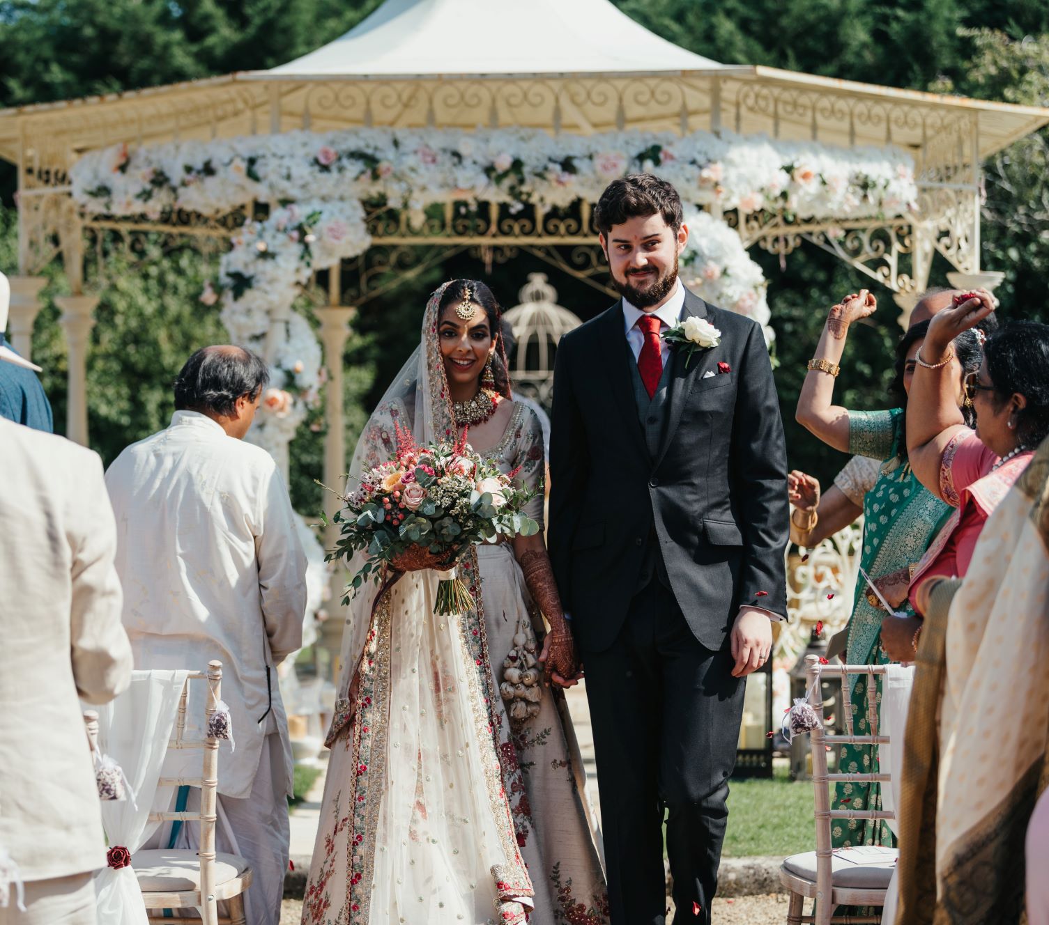 Cotswold Asian Outdoor Wedding walking up the aisle